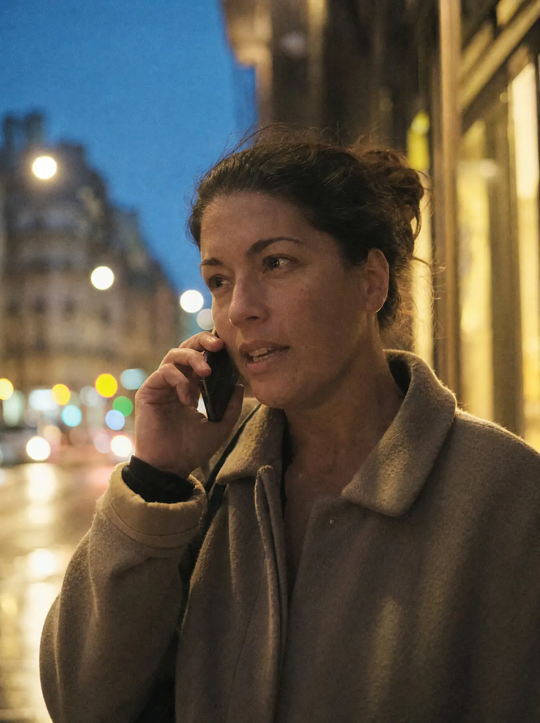 A guest on her mobile phone outside in the evening